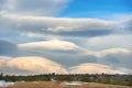Lenticular clouds in the mountains Royalty Free Stock Photo