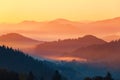 Landscape with beautiful mountains, fields and forests covered with thick morning fog. Interesting sunrise enlightens surroundings