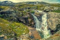 Landscape with beautiful powerful waterfall