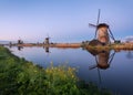 Landscape with beautiful traditional dutch windmills at sunrise Royalty Free Stock Photo