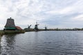 Traditional Old Green Windmills along the Zaan River in Zaanse Schans Netherlands