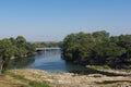 Landscape behind the dam with forest and a river. Royalty Free Stock Photo