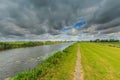 Landscape with bicycle footpath Smitskade between Leidse Vaart and Langeraarse plassen Royalty Free Stock Photo