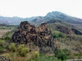 Landscape of black rock cliffs on the slopes of the mountains