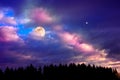 Silhouette of trees and full moon on colorful night sky. Royalty Free Stock Photo