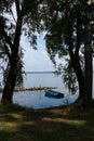 Landscape with blue fishing boat on the lake Seliger, Ostashkov, Russia Royalty Free Stock Photo