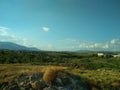 Landscape. Blue Sky with white clouds. The mountains in the distance. Desktop Royalty Free Stock Photo