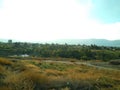 Landscape. Blue Sky with white clouds. The mountains in the distance. Desktop Royalty Free Stock Photo