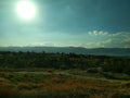 Landscape. Blue Sky with white clouds. The mountains in the distance. Desktop Royalty Free Stock Photo