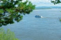 Landscape: boat, blue river, green trees