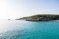 Landscape with boat and turquoise sea water on Cala Mondrago, Majorca island, Spain Royalty Free Stock Photo