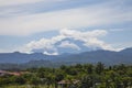 Landscape: Mt Kinabalu, Clouds, Palm Trees Royalty Free Stock Photo