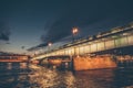 Landscape with bridge at night, view from Neva river in St. Petersburg Royalty Free Stock Photo
