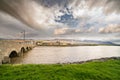 Landscape with a bridge and an old windmill  at Blennerville in Tralee Bay Royalty Free Stock Photo