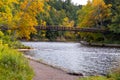 Landscape of a bridge over the Victoria Dam in a forest in autumn in Michigan, the US