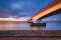 Landscape during a bright sundown. The sea and the bridge. Zeeland bridge, Netherlands Royalty Free Stock Photo