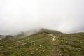 Landscape from Bucegi Mountains, part of Southern Carpathians in Romania in a foggy day Royalty Free Stock Photo