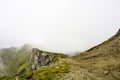 Landscape from Bucegi Mountains, part of Southern Carpathians in Romania in a foggy day Royalty Free Stock Photo