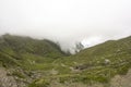 Landscape from Bucegi Mountains, part of Southern Carpathians in Romania in a foggy day Royalty Free Stock Photo