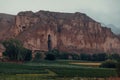 Landscape of Buddhas of Bamyan surrounded by greenery in Afghanistan