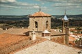 Landscape with buildings and church bellow towers in Trujillo