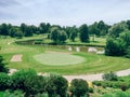 landscape of Canadian Ontario country-side Alliston town with golf course and small lake pond on sunny day.