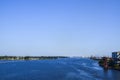 Landscape of cargo shipping with container ships and cranes on the river of Daugava. Riga, Latvia Royalty Free Stock Photo