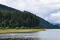 Landscape at Carpathian Mountains, pine forest and mountain lake Royalty Free Stock Photo