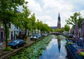 Landscape of the center of Delft with a view on the New Church and on the left horses and carriage Royalty Free Stock Photo