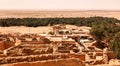 Landscape Chebika oasis in Sahara desert. Ruins settlement and palm Royalty Free Stock Photo