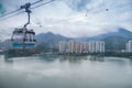 Landscape, cityscape, rainy day, The Building located on the seaside. There are mountains behind the building and a cable car Royalty Free Stock Photo