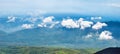 Landscape with clouds, mountains, blue sky and village. Carpathians, Ukraine.