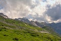 Cloudy mountain tops with glaciers in the French Alps