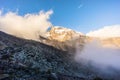 Landscape of the cloudy peak of Mount Kilimanjaro under sunlight and shadow Royalty Free Stock Photo