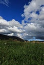 Meadow and cloudy sky in Pyrennes. Royalty Free Stock Photo