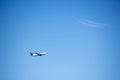 Landscape of commercial plane flying in sky in Keflavik Iceland