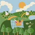 Landscape composition with picnic basket and badminton set Royalty Free Stock Photo