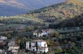 landscape of the counytryside near Arezzo with a village, hills and mountains in autumn colors