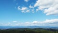 Landscape covered with green forest beautiful day Blue sky and white clouds