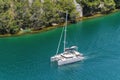 Landscape of a cruise ship on the river surrounded by greenery in Skradin, Croatia