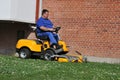 LANDSCAPE CUTTING GRASS IN OPEN LAWN IN COPENHAGEN