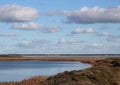 Landscape of danish fjord with windmills in the horizon Royalty Free Stock Photo