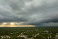 Landscape of dark ominous clouds forming on stormy sky before heavy thunderstorm over rural town area Royalty Free Stock Photo