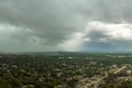 Landscape of dark ominous clouds forming on stormy sky before heavy thunderstorm over rural town area Royalty Free Stock Photo