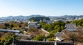 Landscape day view from the top of Himeji Castle overlooking Himeji city and fortifications in autumn, Japan. Royalty Free Stock Photo