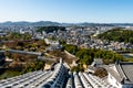 Landscape day view from the top of Himeji Castle overlooking Himeji city and fortifications in autumn, Japan. Royalty Free Stock Photo