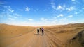 Mountain bikers riding the bike in a desert road