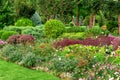 A landscape design colorfully flowerbed with lots flowers.
