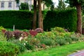 a landscape design colorfully flowerbed with lots flowers and plants.