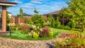 Landscape design at residential house. Beautiful landscaping in home garden Royalty Free Stock Photo